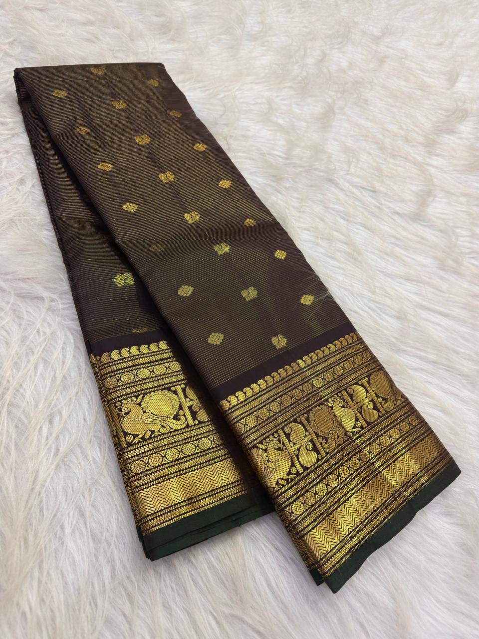 Dark Brown handwoven Pure Silk Kanchipuram saree showing the full body and contrast zari border.