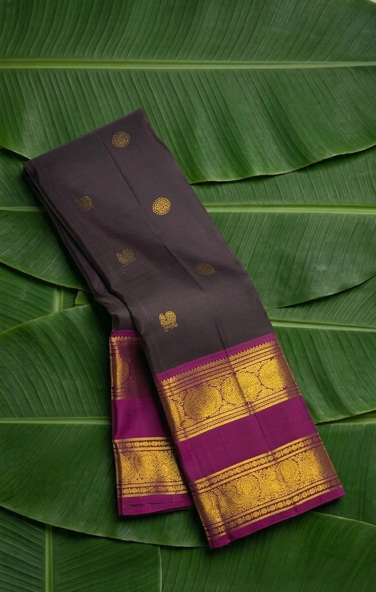 Dark charcoal zari kattam Kancheepuram saree with magenta contrast border and gold zari pallu — Idam Living