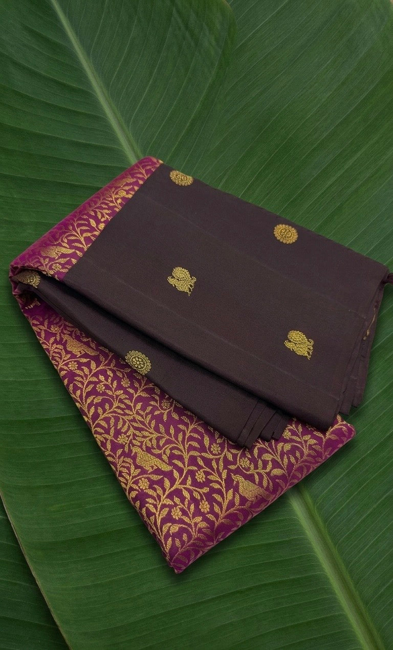 Dark cocoa brown Vanasringaram Kanchipuram silk saree with rani pink floral jaal pallu – front view