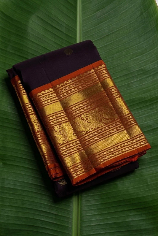 Dark cocoa purple Kanchipuram silk saree with ember orange varisaipet border