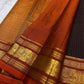 rust border detail of dark coffee brown Kanchipuram silk saree