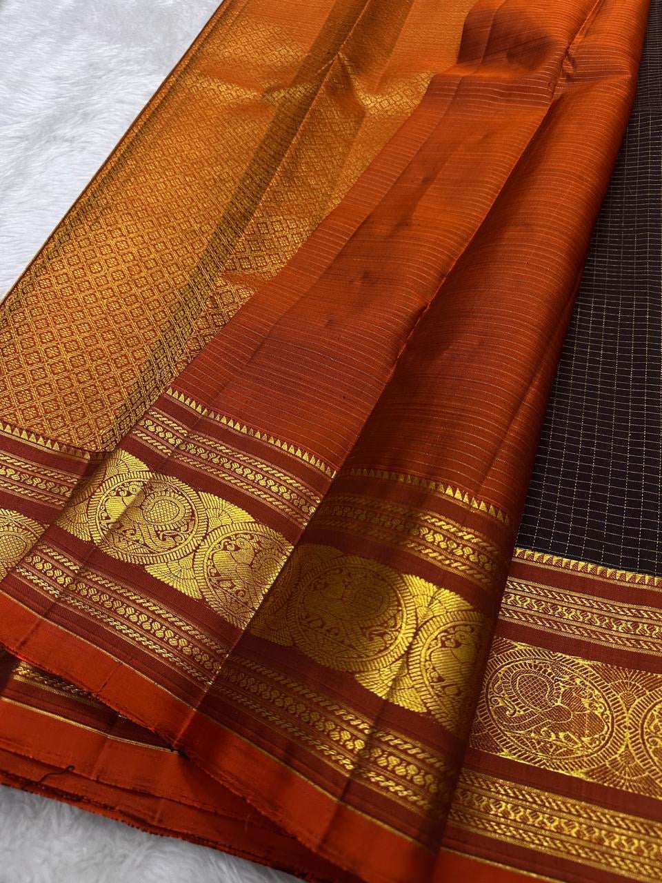 rust border detail of dark coffee brown Kanchipuram silk saree