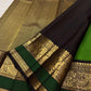 Dramatic dark contrast border with stylised Mayil and floral gold-zari work.