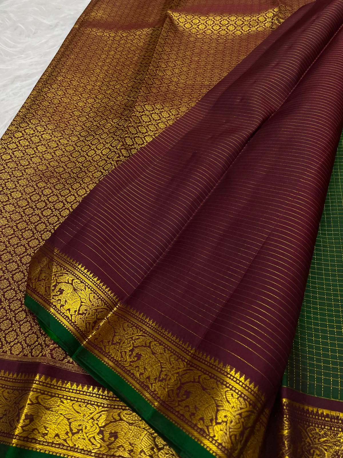 Gold zari kattam checks on deep forest-green pure silk Kanchipuram saree