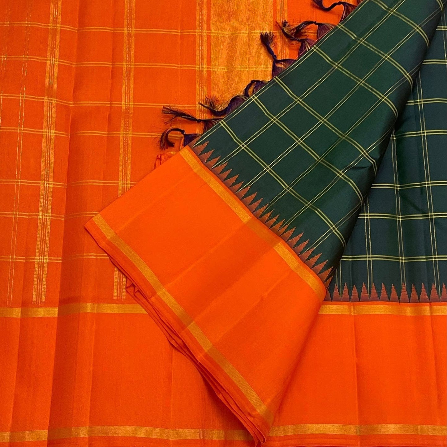 Dark Green Handwoven Pure Silk Kanchipuram Saree with Orange Pillayar Reku Korvai Border