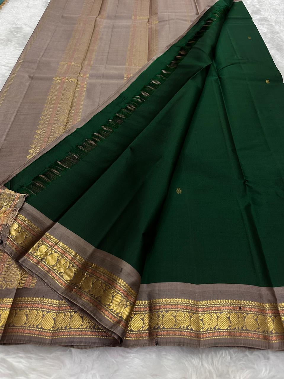 Pure Kanchipuram silk saree pallu detail in brown tone with woven gold zari elements