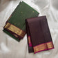 Two folded pure Kanchipuram silk sarees in green and deep brown with zari borders on beige backdrop
