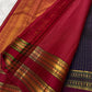 Maroon pallu of Pure Kanchipuram silk saree with gold zari woven geometric pattern and wide zari woven border bands