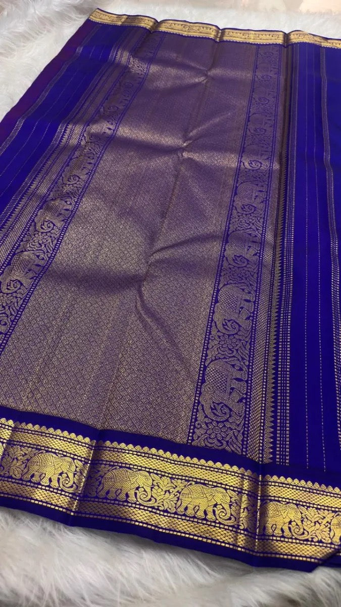 Dark Red Chakram butta motif on Korvai Kanjivaram saree