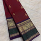 Deep Arakku Maroon Pure Silk Kanchipuram Butta saree with a Yaanai gold-zari border.