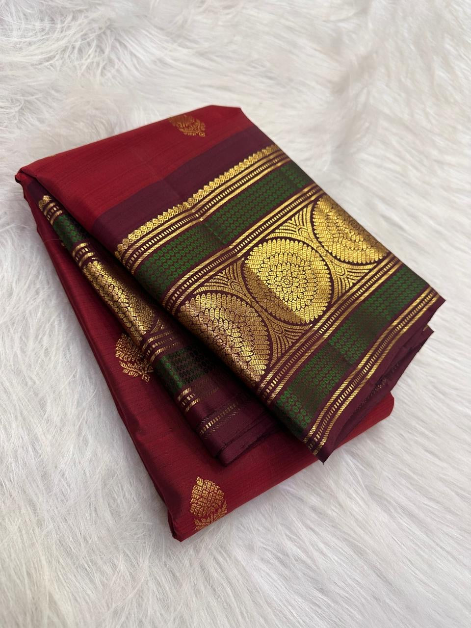 Deep Arakku Red Pure Silk Kanchipuram Butta saree with grand Kamalam gold zari border