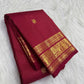 Deep red Kanjeevaram saree with majestic Yazhi border
