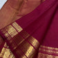 Deep red Kanchipuram saree with Yazhi and Mayil zari border