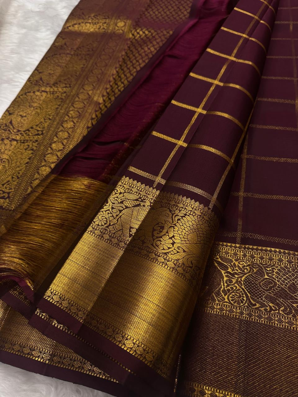 Deep Aubergine Pure Silk Kanchipuram saree with antique gold border detail, close styled shot.