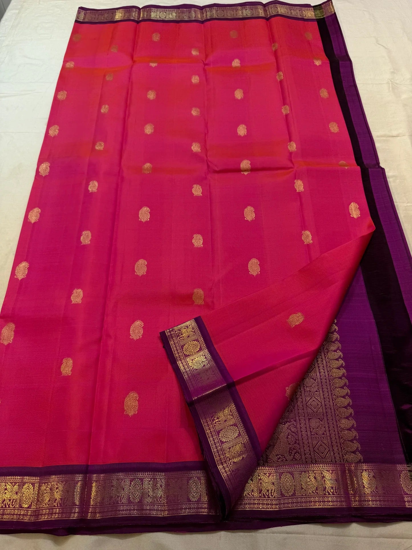 Raspberry Pink pure silk KanchiPattu saree — deep aubergine border detail