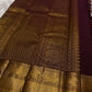 Deep Aubergine Kanchipuram silk saree with antique gold Zari Kattam grid, full drape view.