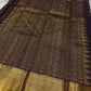 Close view of antique gold Mayil border and Zari Kattam body on Deep Coffee Brown Pure Silk Kanchipuram saree.