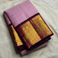 Deep Aubergine Korvai border with raspberry accents and layered gold zari on lavender Kanchipuram saree.