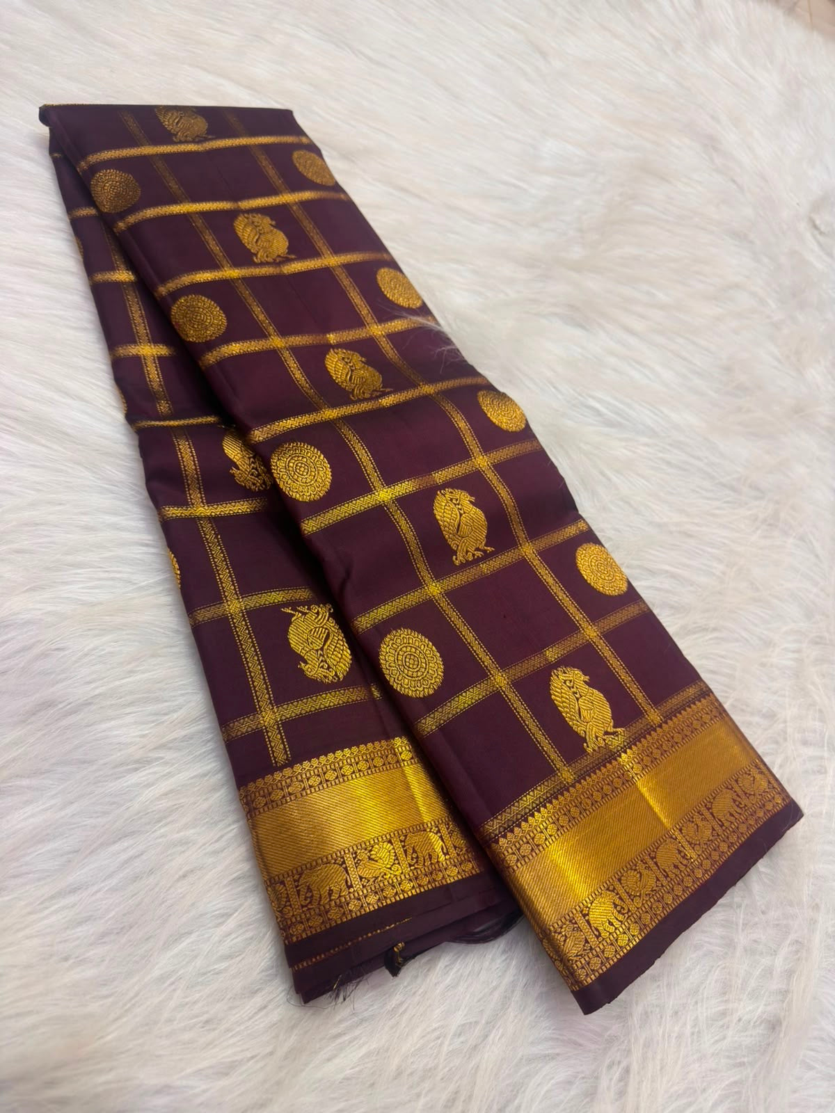 Deep aubergine handwoven pure silk Kancheepuram Zari Kattam saree with Mayil Chakram zari motifs, full view