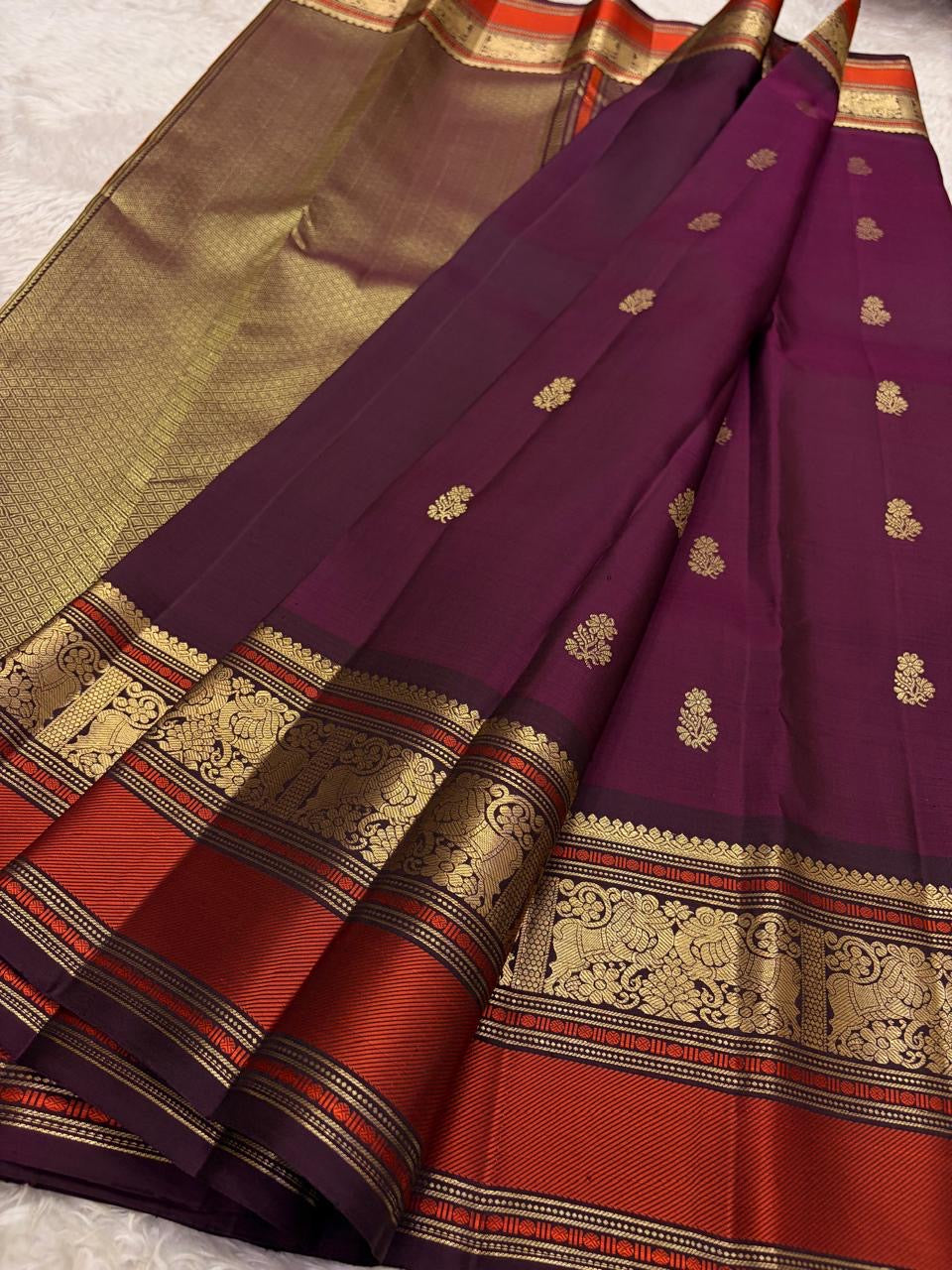 Deep Aubergine Kancheepuram Saree — Korvai border with burnt-orange silk-thread panel and gold zari peacock motifs