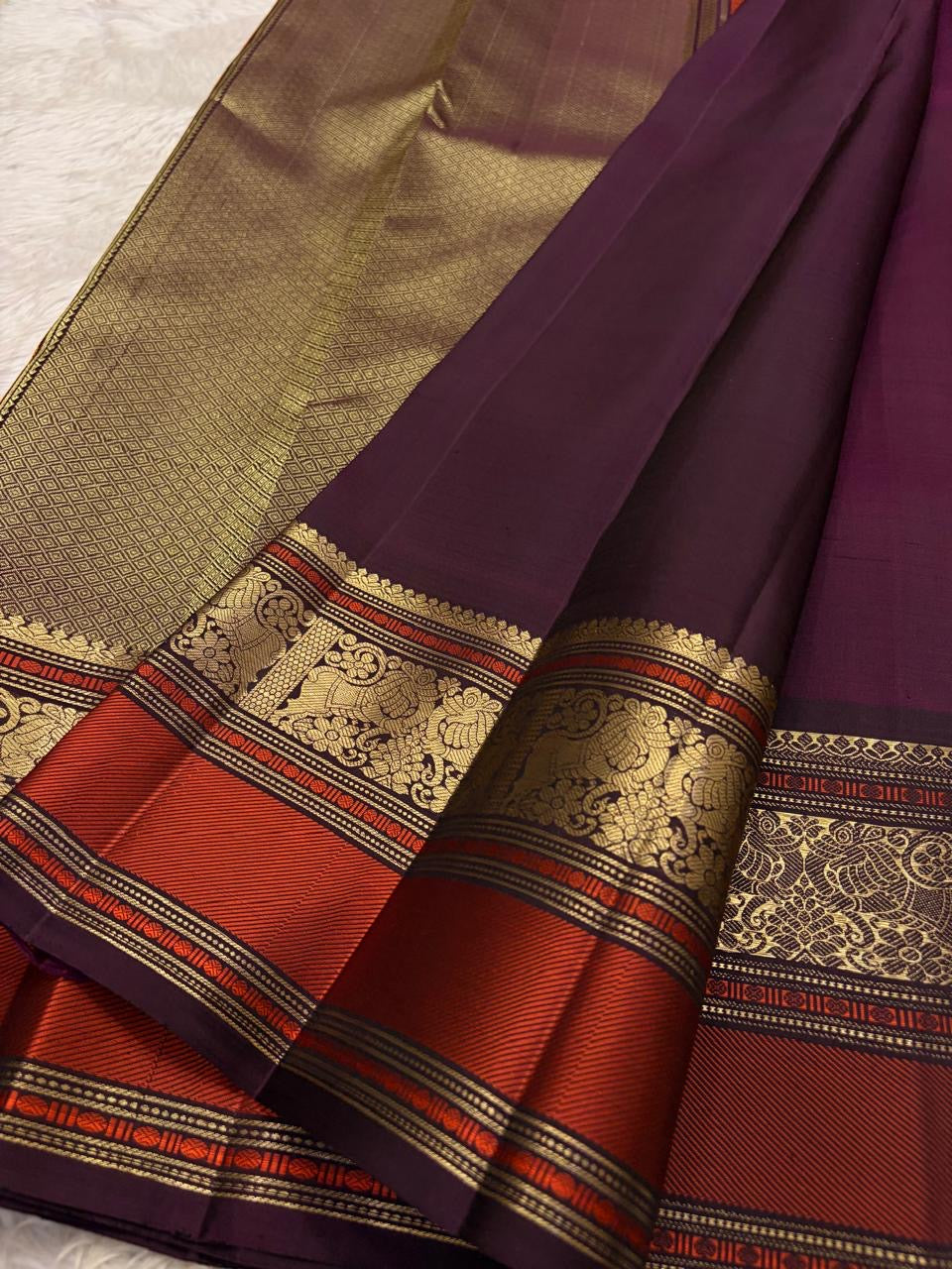 Deep Aubergine Kancheepuram Saree — pallu detail with burnt-orange and gold zari peacock work