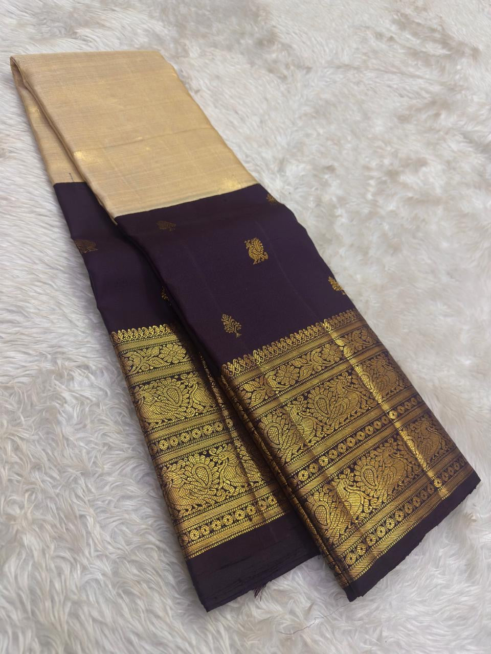 Pure silk Kanchivaram saree with ornate peacock and floral motifs woven in antique gold zari