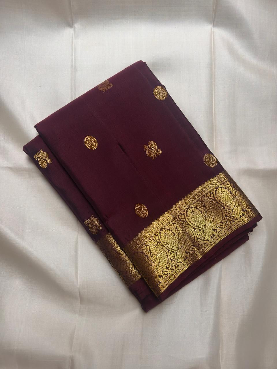 Pure Silk Kanchipuram Butta saree with traditional peacock motif zari border