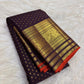 Deep Brown Kanchipuram silk saree with petite handwoven gold zari buttas.