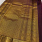 Close view of antique gold zari buttas on deep aubergine Kanchipuram silk