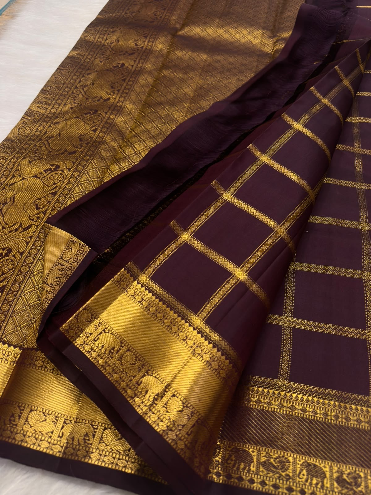 Deep aubergine pure silk Zari Kattam Kancheepuram saree, draped front view