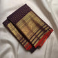 Deep Aubergine Purple handwoven pure silk Kanjivaram Butta saree with fine antique-gold zari buttas.
