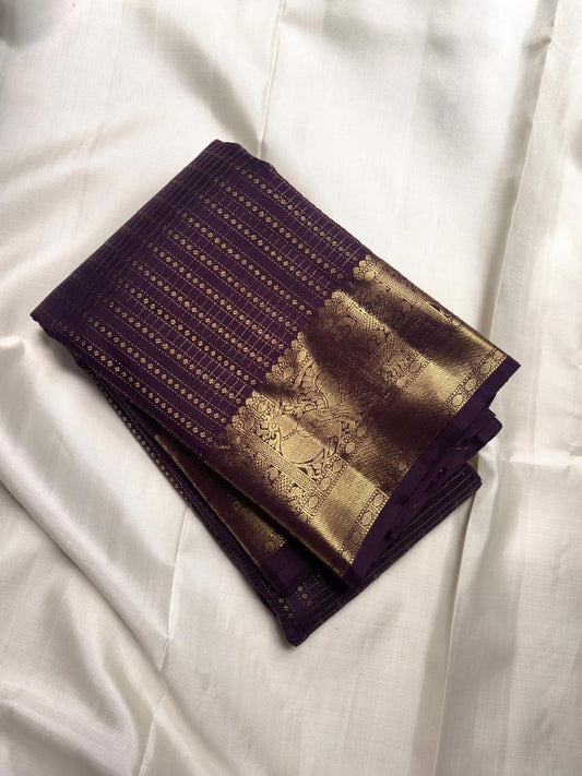 Deep Aubergine Purple handwoven pure silk Kanjivaram Butta saree with antique-gold zari.