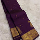 Intricate gold Mayil zari border on Deep Aubergine Purple Kanjeevaram silk saree