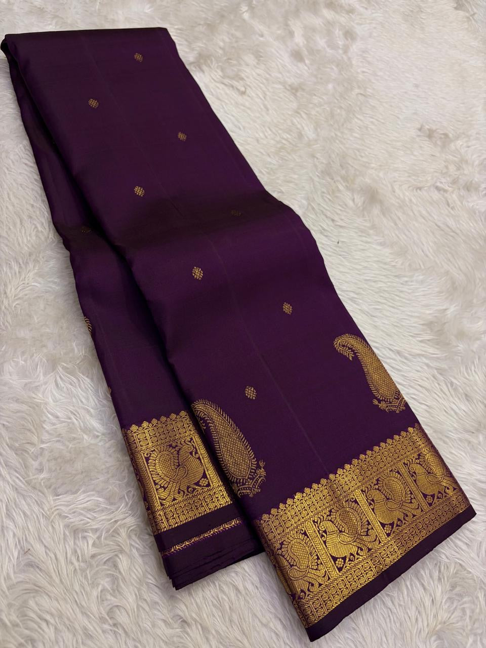 Intricate gold Mayil zari border on Deep Aubergine Purple Kanjeevaram silk saree
