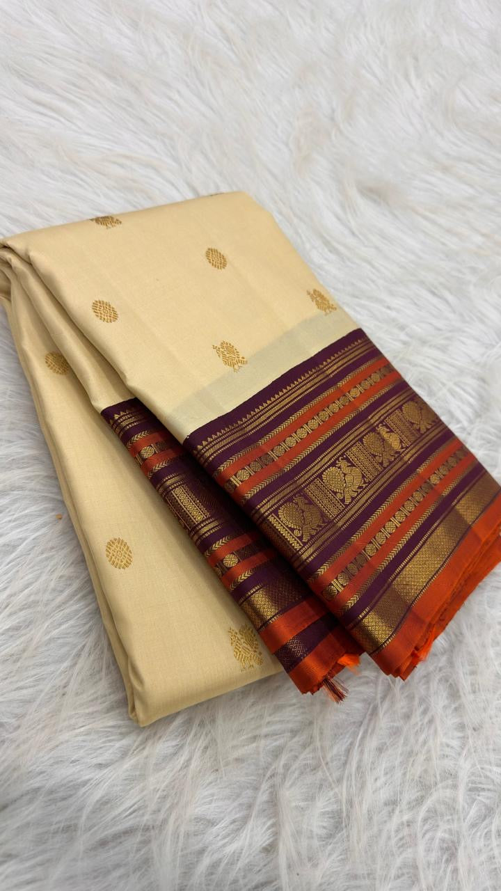 Warm Ivory handwoven Kanjivaram saree with purple orange and antique-gold multi-register border.