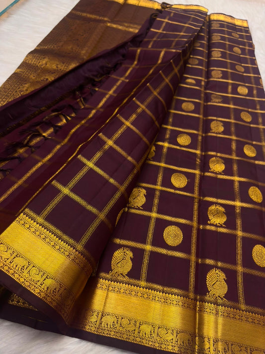 Deep aubergine Zari Kattam Kanchipuram saree with Mayil Chakram, close-up