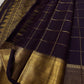Deep Coffee Brown Kanchipuram silk saree with antique gold checked body, handwoven Gandaberunda motifs and ornate Mayil zari border.