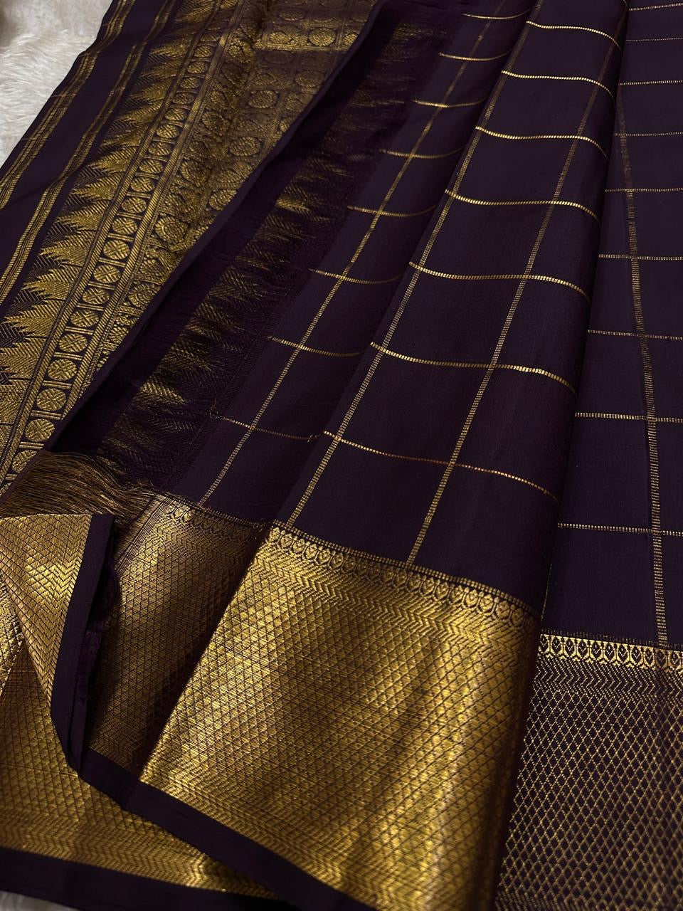 Deep Coffee Brown Kanchipuram silk saree with antique gold checked body, handwoven Gandaberunda motifs and ornate Mayil zari border.