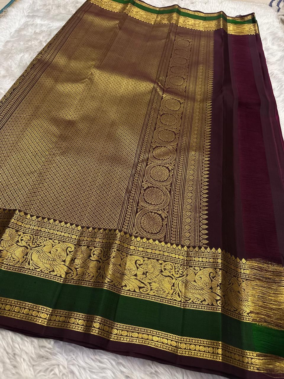 Kanchipattu silk saree in korvai with deep berry pink border weave traditional zari detail