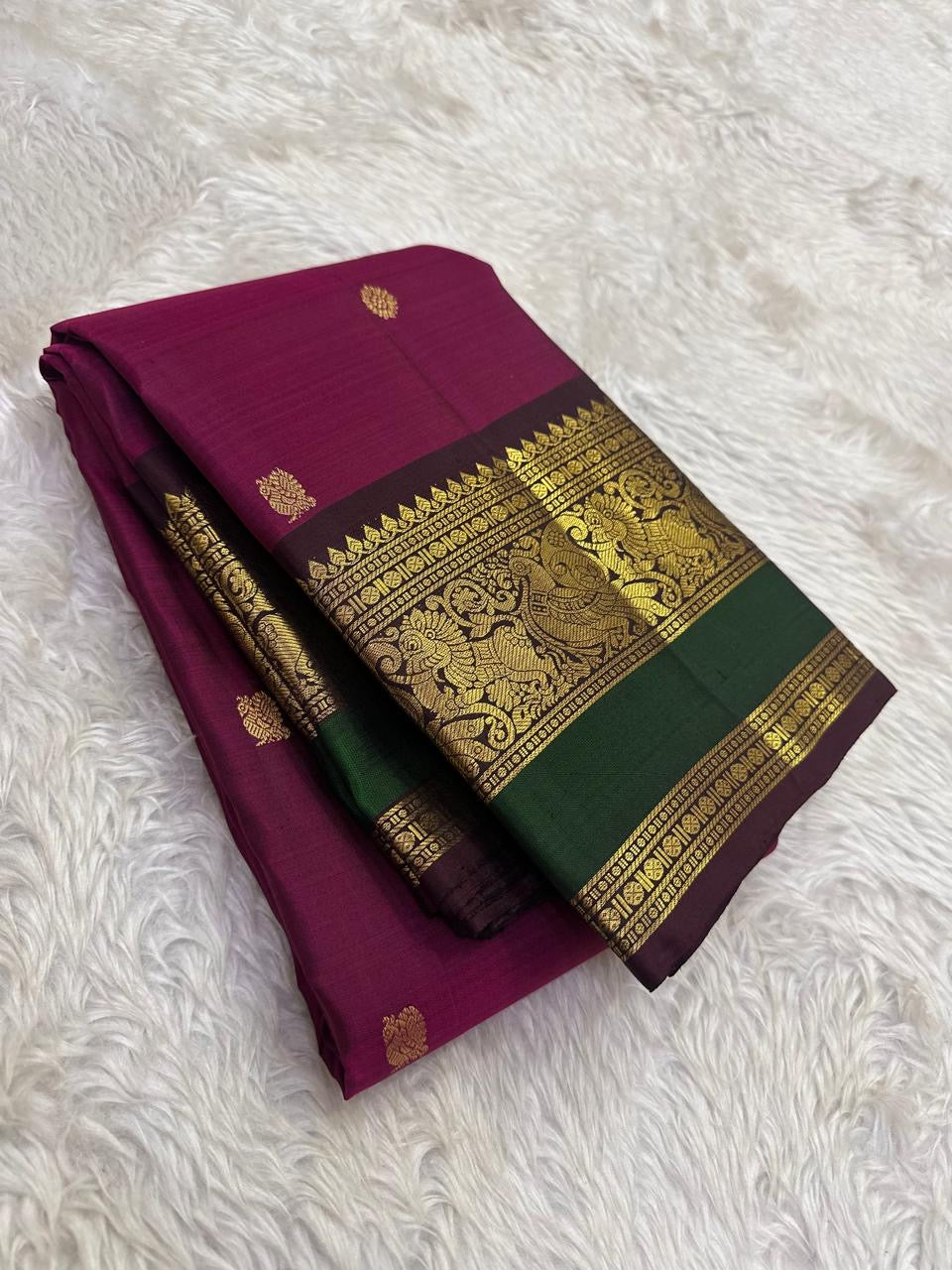 Kanchipattu silk saree in korvai with deep berry pink border weave traditional zari detail