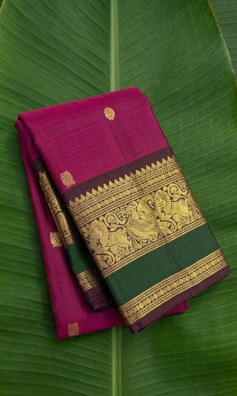 Kanchipuram silk saree in korvai with deep berry pink border weave folded view