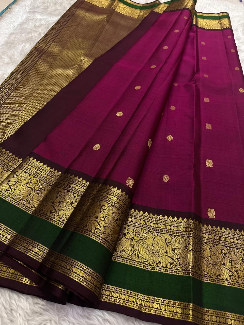 Kanchipattu silk saree in korvai with deep berry pink border weave traditional zari detail