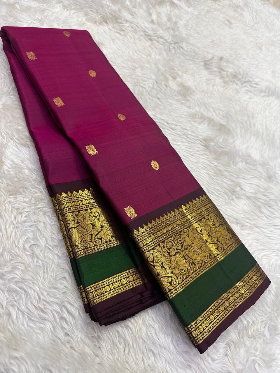 Kanchipattu silk saree in korvai with deep berry pink border weave traditional zari detail