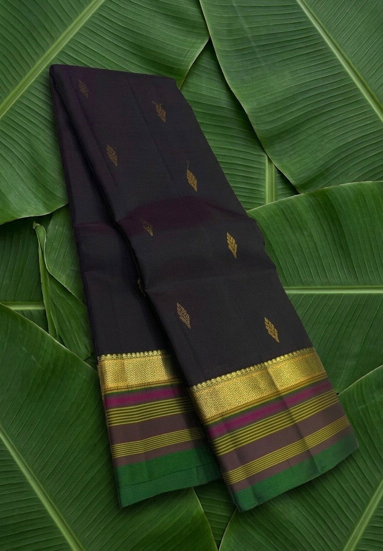 Deep black handwoven Kancheepuram pure silk saree with chedi butta and multi-colour varisaipet border — Idam Living