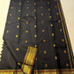 Luxury black Kanchipattu silk saree with richly woven meenakari pallu artistry.