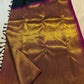 Close-up of the copper-gold Ettukol border on the deep bottle green Kanchipuram silk saree