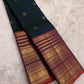 Close view of Varisaipet body showing Mayil Butta in gold zari on deep bottle green silk