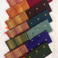 Rust orange pallu with red silk thread motifs on deep bottle green Varisaipet saree