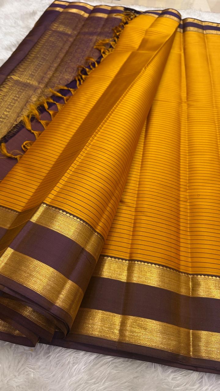 Marigold Orange pure silk Kancheepuram saree — deep brown border