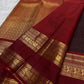 Handwoven Kanchana Brown Zari Kattam saree with spaced gold zari buttas and red contrast border.